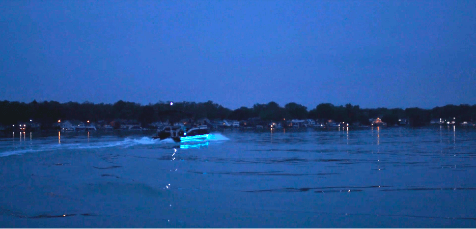 a boat on the water at night